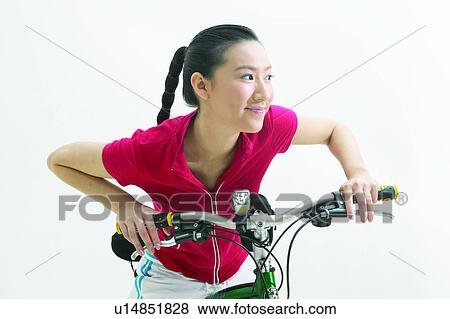 Casual Clothing, Bending, Braids, Black Hair, Bicycle, Asian Ethnicity View Large Photo Image Stock Photo - Casual Clothing, Bending, Braids, Black Hair, Bicycle, Asian Ethnicity. Fotosearch