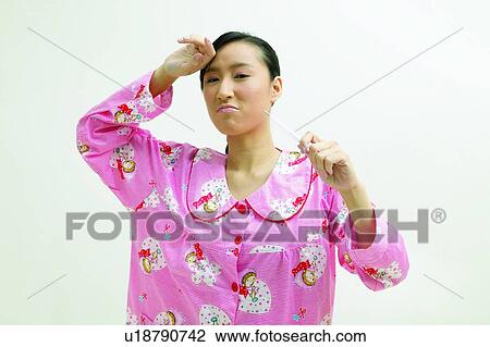Stock Image - Close-Up, Examining, Asian Ethnicity. Fotosearch