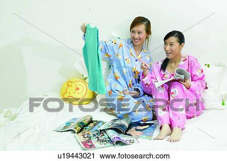 Lifestyles, Asian Ethnicity, Magazine, Long Hair, Pointing, Adults Only View Large Photo Image Stock Image - Lifestyles, Asian Ethnicity, Magazine, Long Hair, Pointing, Adults Only. Fotosearch
