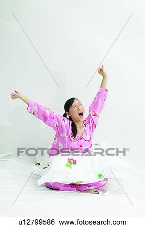 Stock Photograph - Looking Up, Long Hair, Morning Girl, Flexibility, Asian Ethnicity. Fotosearch