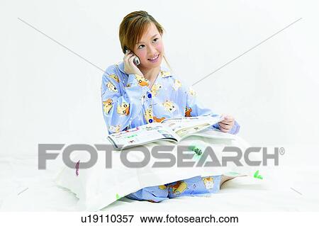 Magazine, Nightwear, Toothy Smile, One Young Woman Only, Smiling, Young Adult View Large Photo Image Stock Photo - Magazine, Nightwear, Toothy Smile, One Young Woman Only, Smiling, Young Adult. Fotosearch