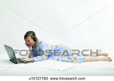 One Young Woman Only, Hand On Chin, Toothy Smile, Laptop, Connection, Asian Ethnicity View Large Photo Image Stock Image - One Young Woman Only, Hand On Chin, Toothy Smile, Laptop, Connection, Asian Ethnicity. Fotosearch