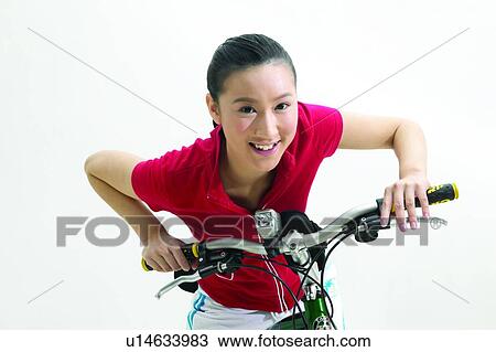 Stock Image - Smiling, Cheerful, Morning, T-Shirt, Asian Ethnicity, Hobbies. Fotosearch