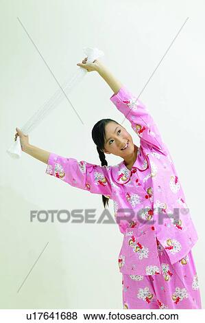 Stretching, Indoor, Asian Ethnicity, Leisure Activity, Toothy Smile View Large Photo Image Stock Photo - Stretching, Indoor, Asian Ethnicity, Leisure Activity, Toothy Smile. Fotosearch