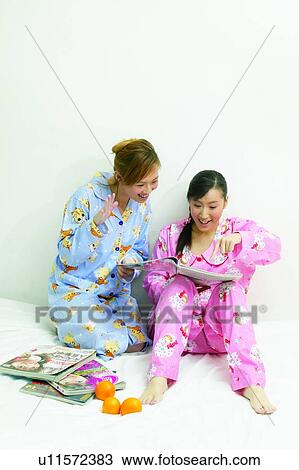 Stock Image - Togetherness, Black Hair, Happiness, Young Adult, Nightwear, Long Hair. Fotosearch