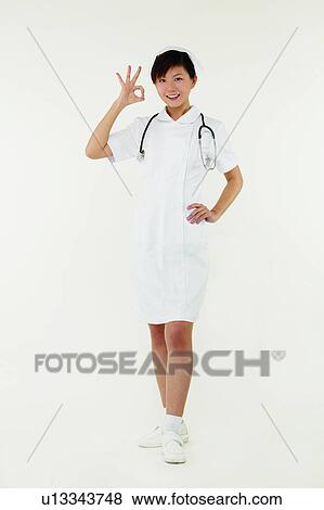 Asian Ethnicity, Cheerful, Brown Hair, Agreement View Large Photo Image Stock Photo - Asian Ethnicity, Cheerful, Brown Hair, Agreement. Fotosearch