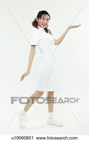 Stock Image - Black Hair, Female Nurse, Cut Out, Asian Ethnicity. Fotosearch