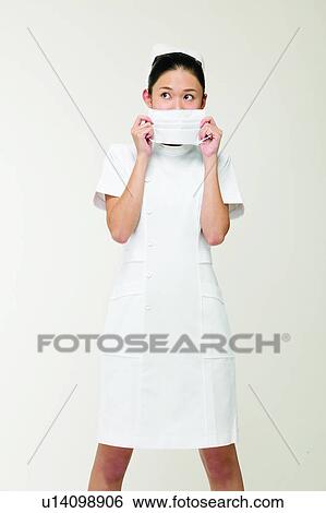 Stock Photograph - Black Hair, Female Nurse, Cut Out, Asian Ethnicity. Fotosearch