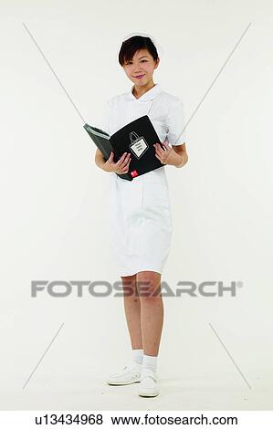 Stock Photo - Brown Hair, Female Nurse, Cut Out, Asian Ethnicity. Fotosearch