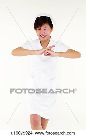 Brown Hair, Gesturing, Smiling, Healthcare And Medicine, Uniform, One Person, Cut Out View Large Photo Image Picture - Brown Hair, Gesturing, Smiling, Healthcare And Medicine, Uniform, One Person, Cut Out. Fotosearch