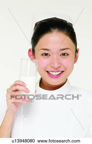 Stock Image - Glass, Skill, Portrait, Standing, Head And Shoulders, Toothy Smile, Asian Ethnicity. Fotosearch