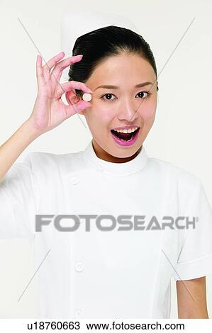 Stock Image - Holding, Hair Back, Mouth Open, Portrait, One Person. Fotosearch