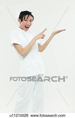 Stock Photograph - Mouth Open, Pointing, Healthcare And Medicine, One Person, Smiling. Fotosearch