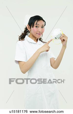 Stock Photograph - One Person, Looking At Camera, Black Hair, Indoor, Portrait, Three-Quarter Length. Fotosearch