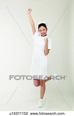 Stock Image - One Person, Skill, Medical Occupation, Uniform, Standing On One Leg, Professional Occupation. Fotosearch