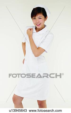 Stock Image - One Young Woman Only, Medical Occupation, Cheerful, Uniform. Fotosearch