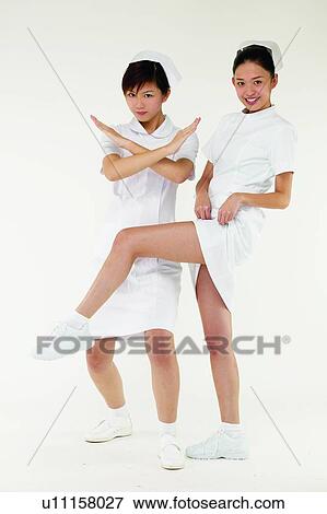 Stock Photo - Posing, Standing On One Leg, Black Hair, Professional Occupation, Happiness, Medical Occupation, White Background. Fotosearch