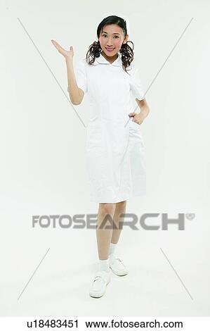 Smiling, Hand On Hip, Female Nurse, Happiness, Indoor, Looking At Camera, Portrait View Large Photo Image Stock Image - Smiling, Hand On Hip, Female Nurse, Happiness, Indoor, Looking At Camera, Portrait. Fotosearch