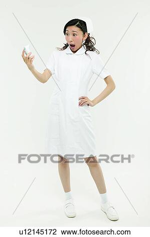 Stock Image - Standing, Healthcare And Medicine, Hand On Hip, Shock, Skill. Fotosearch