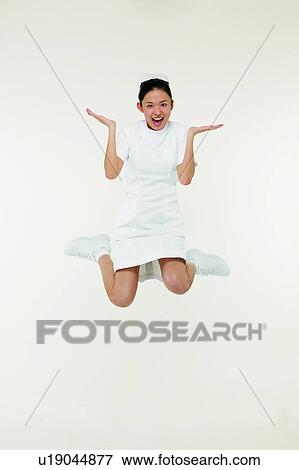 Toothy Smile, Hair Back, Mid-Air, Cheerful, Black Hair, Smiling View Large Photo Image Stock Photo - Toothy Smile, Hair Back, Mid-Air, Cheerful, Black Hair, Smiling. Fotosearch