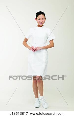 Stock Photo - Toothy Smile, Hair Back, White Background, Nurse, Young Adult. Fotosearch