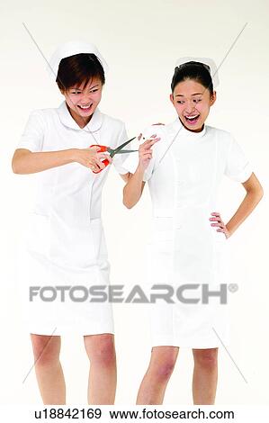 Stock Photo - Toothy Smile, Looking Away, Uniform, Three-Quarter Length, Bonding. Fotosearch