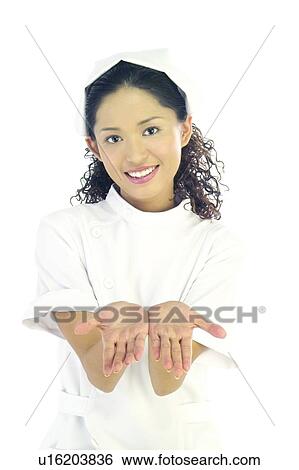 Stock Photograph - Uniform, Close-Up, Female Nurse, Hair Back, Toothy Smile. Fotosearch