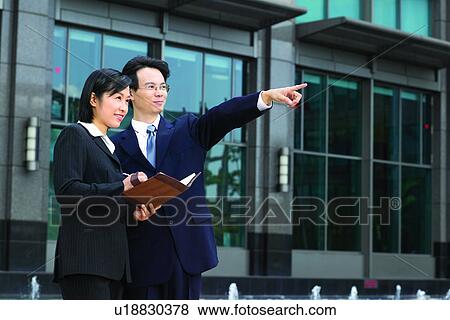 Asian Ethnicity, Business Suit, Building Structure, Building Exterior, Adults Only View Large Photo Image Stock Photo - Asian Ethnicity, Business Suit, Building Structure, Building Exterior, Adults Only. Fotosearch