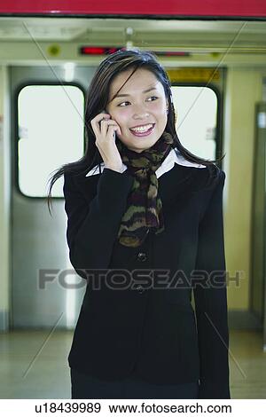Brown Hair, Cheerful, Businesswoman, Business Suit, Asian Ethnicity View Large Photo Image Stock Photo - Brown Hair, Cheerful, Businesswoman, Business Suit, Asian Ethnicity. Fotosearch