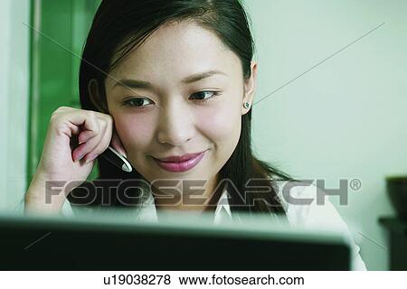 Stock Photo - Brown Hair, Efficiency, Businesswoman, Asian Ethnicity. Fotosearch