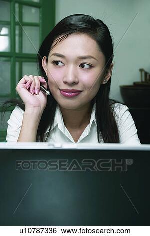 Stock Photograph - Brown Hair, Facial Expression, Efficiency, Asian Ethnicity. Fotosearch