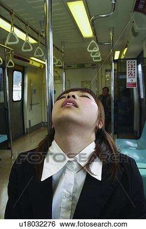 Stock Photograph - Brown Hair, Formal Clothing, Exhaustion, One Person, Train, Travel. Fotosearch