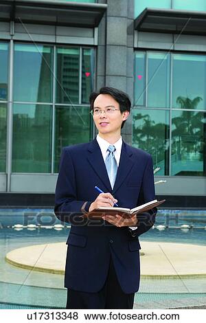 Building Exterior, Businessman, Business Suit, Building Structure, Asian Ethnicity View Large Photo Image Stock Photo - Building Exterior, Businessman, Business Suit, Building Structure, Asian Ethnicity. Fotosearch
