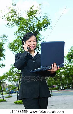 Business Suit, Cheerful, Car, Businesswoman, Asian Ethnicity View Large Photo Image Stock Photo - Business Suit, Cheerful, Car, Businesswoman, Asian Ethnicity. Fotosearch