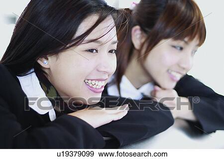 Stock Photo - Businesswomen, Asian Ethnicity, Business Suit, Brown Hair, Bangs, Adults Only. Fotosearch