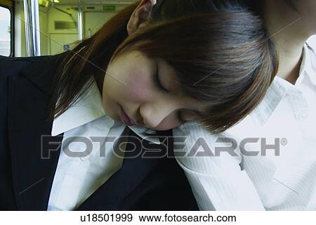 Stock Photo - Button Down Shirt, Bangs, Businesswomen, Business Suit, Brown Hair, Asian Ethnicity. Fotosearch