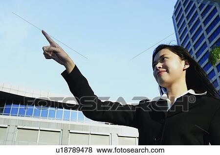Clear Sky, Building Exterior, Businesswoman, Business Suit, Building Structure, Asian Ethnicity View Large Photo Image Stock Photo - Clear Sky, Building Exterior, Businesswoman, Business Suit, Building Structure, Asian Ethnicity. Fotosearch