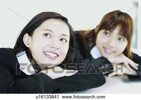 Stock Image - Indoor, Young Adult, Toothy Smile, Cheerful, Close-Up. Fotosearch