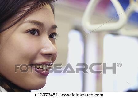 Public Transportation, Office Lady, Vehicle Interior, Close-Up, Asian Ethnicity, Looking Away View Large Photo Image Stock Image - Public Transportation, Office Lady, Vehicle Interior, Close-Up, Asian Ethnicity, Looking Away. Fotosearch
