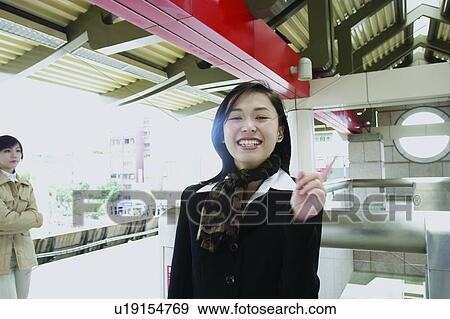 Waiting, Journey, Looking At Camera, Young Women, Cravat, Business Suit, Arms Crossed View Large Photo Image Stock Photo - Waiting, Journey, Looking At Camera, Young Women, Cravat, Business Suit, Arms Crossed. Fotosearch