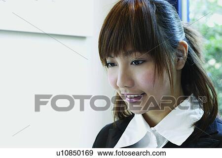 Stock Photo - Young Adult, Formal Clothing, Long Hair, Focus On Foreground, Cheerful, Day. Fotosearch