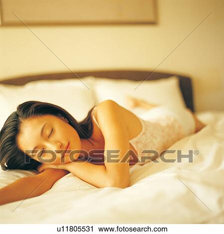 Stock Image - Comfortable, Bedroom, Square, Youth Culture, Prime Time, Focus On Foreground, Lying On Front. Fotosearch