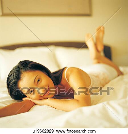 Stock Photo - Looking At Camera, Medium-Length Hair, Focus On Foreground, Black Hair, Portrait. Fotosearch
