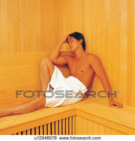 Stock Photo - Towel, One Person, Eyes Closed, Wood Paneling, Three-Quarter Length. Fotosearch