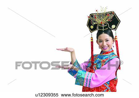 Stock Photography - Beauty, Chinese Ethnicity, Cut Out, Tassel, Indoor, Gesturing, Eastern. Fotosearch
