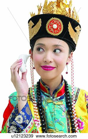 Stock Photo - One Young Woman Only, Princess Of China, Headdress, Beauty, Holding, Happiness, Traditional Clothing. Fotosearch