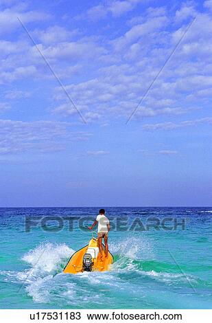 Stock Image - Cloud, One Person, Ocean, Day, Adventure. Fotosearch