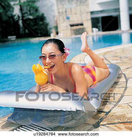 Asian, Bikini, At The Edge Of, Enjoyment, Asian Ethnicity View Large Photo Image Picture - Asian, Bikini, At The Edge Of, Enjoyment, Asian Ethnicity. Fotosearch