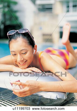 Stock Image - Asian, Black Hair, Bikini, Barefoot, Asian Ethnicity. Fotosearch