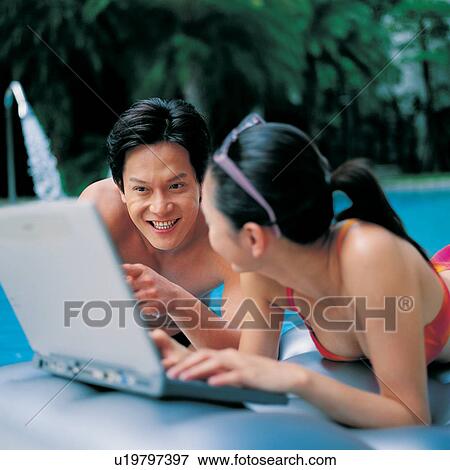 Bending, Relaxation, Bikini, Leaning, Romance, Vacations, Showing View Large Photo Image Stock Photo - Bending, Relaxation, Bikini, Leaning, Romance, Vacations, Showing. Fotosearch